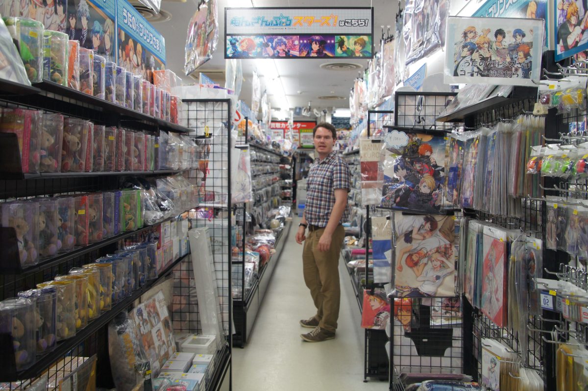 DSC09797 2 Shelves of anime merchandise and colourful character displays in a Den Den Town shop