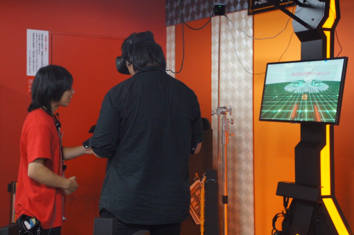 DSC09805 2 Visitor using a virtual-reality headset in a Den Den Town arcade