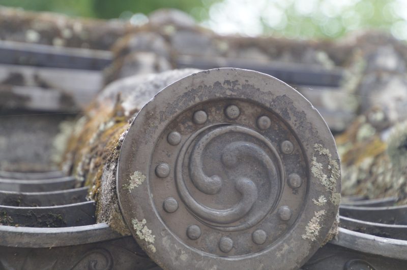 Round roof tiles with family crests on Himeji Castle walls