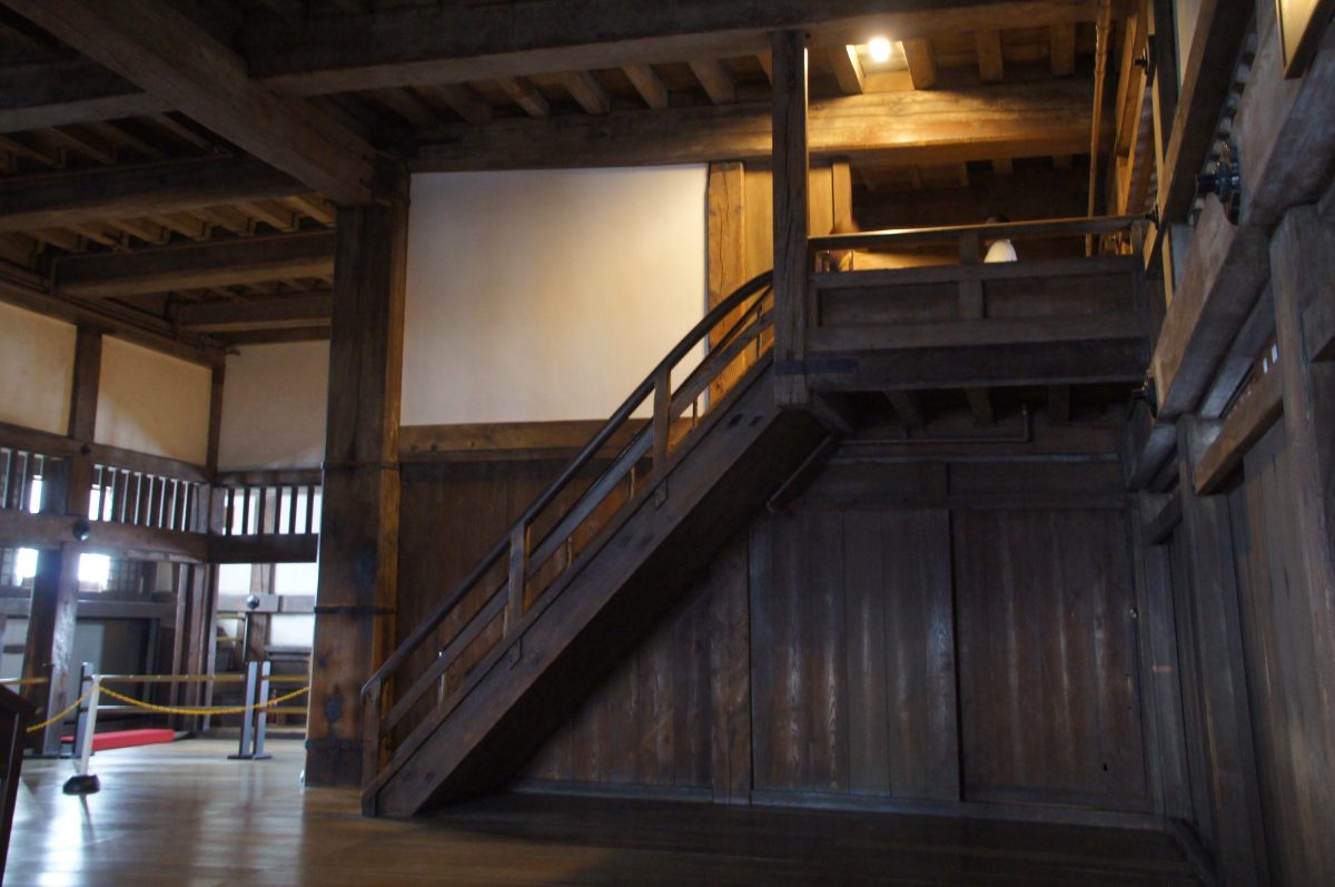 Steep wooden staircase inside Himeji Castle