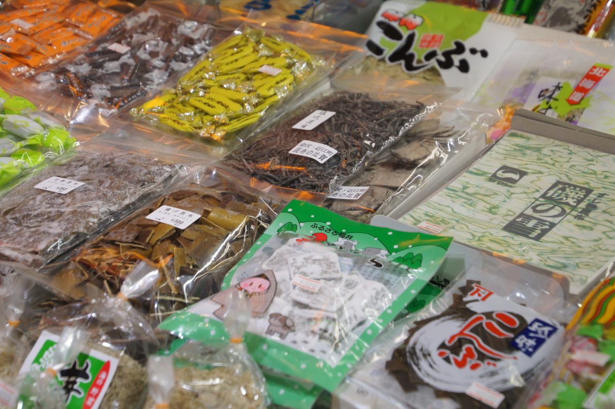 Packaged seafood and local goods displayed inside Omicho Market