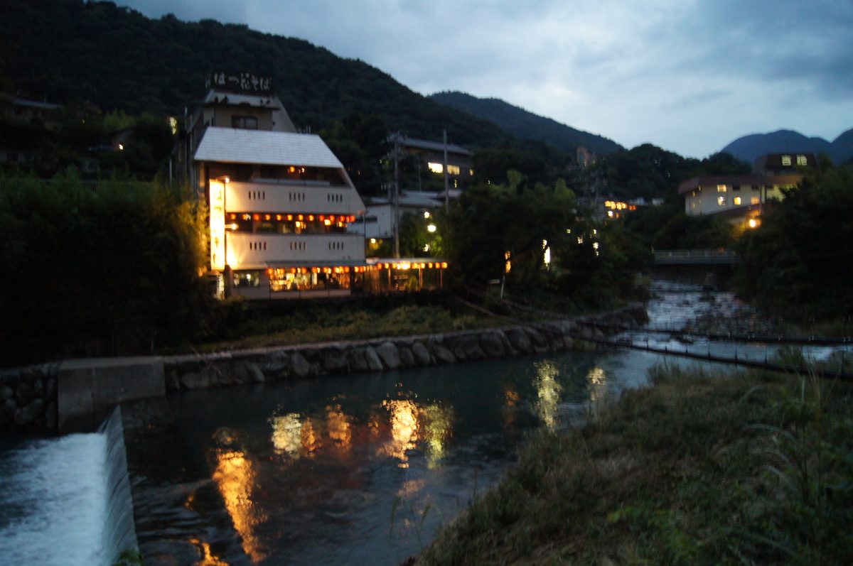 Hakone 103 Lights from riverside inns reflected in the water at dusk in Hakone.