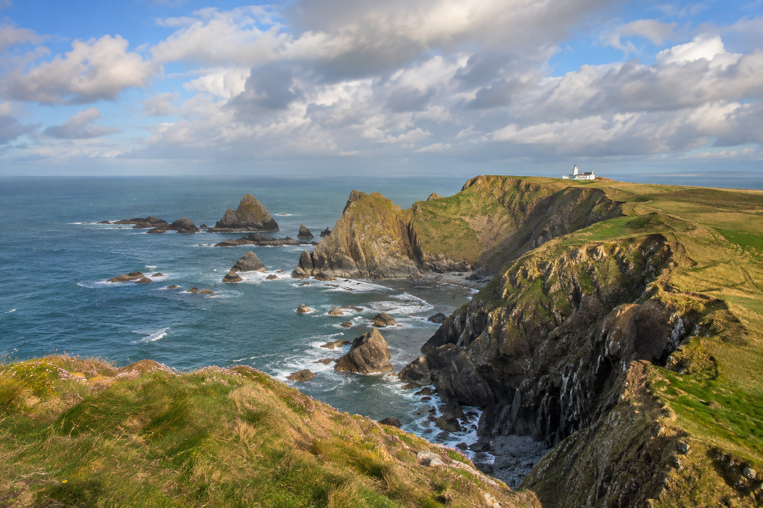 Rugged cliffs and lighthouse at Hartland Point on the North Devon coast