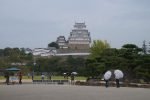 Himeji Castle seen from the lawn on a rainy day trip from Osaka