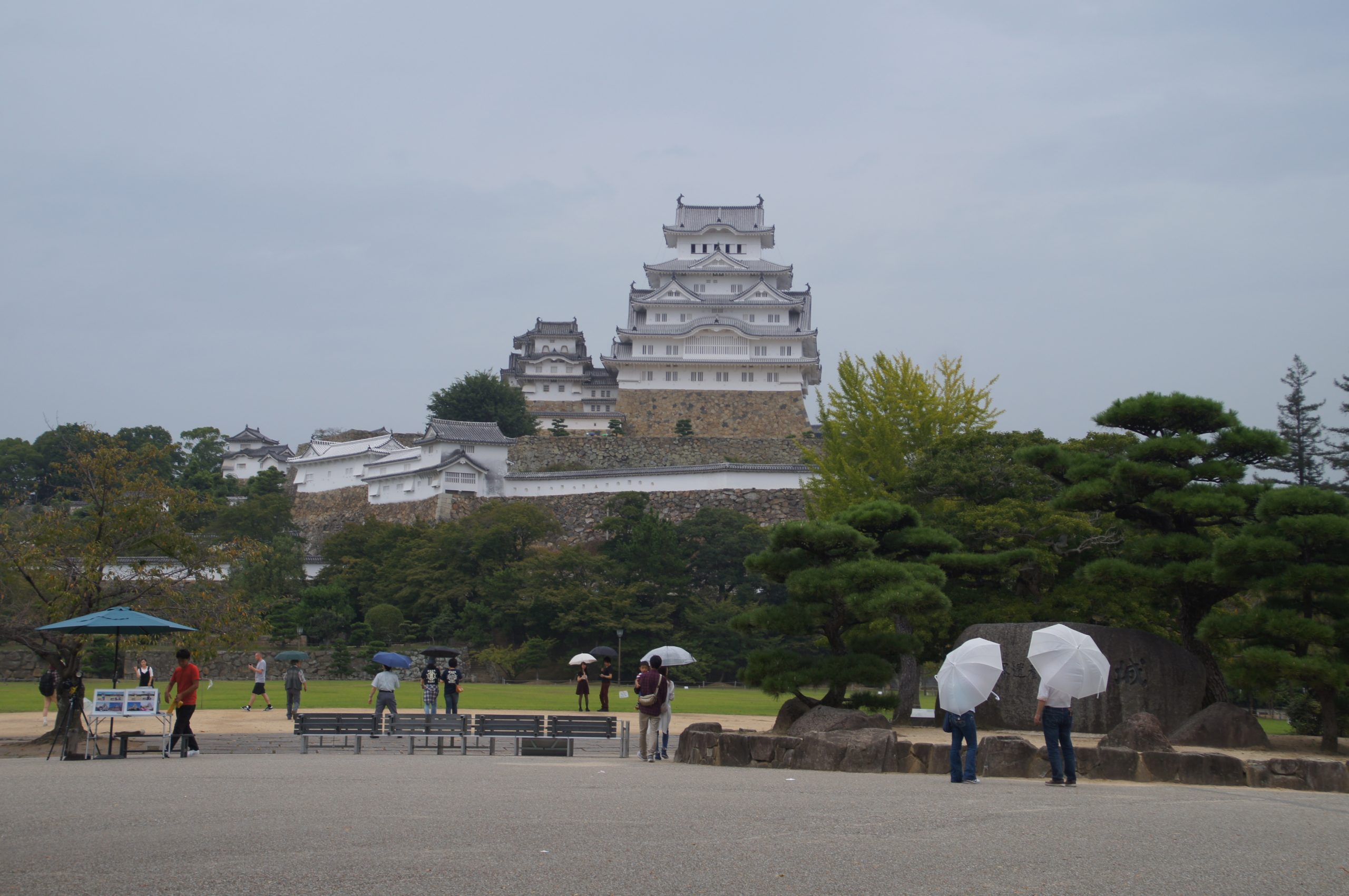 Himeji Castle seen from the lawn on a rainy day trip from Osaka