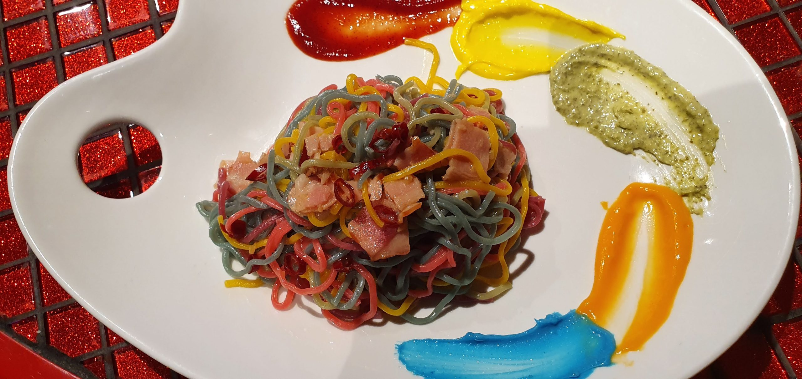 Kawaii Monster Cafe Tokyo 70 scaled Rainbow painter's pasta served on a palette-shaped plate at Kawaii Monster Cafe