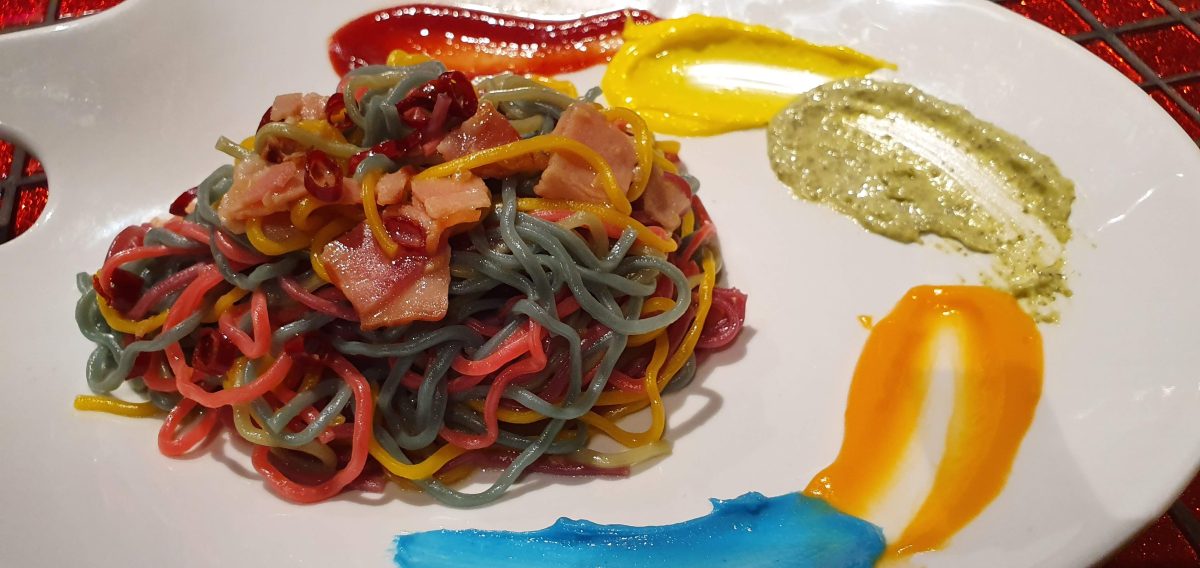 Kawaii Monster Cafe Tokyo 75 Rainbow-coloured painter's pasta on a palette-shaped plate at Kawaii Monster Cafe