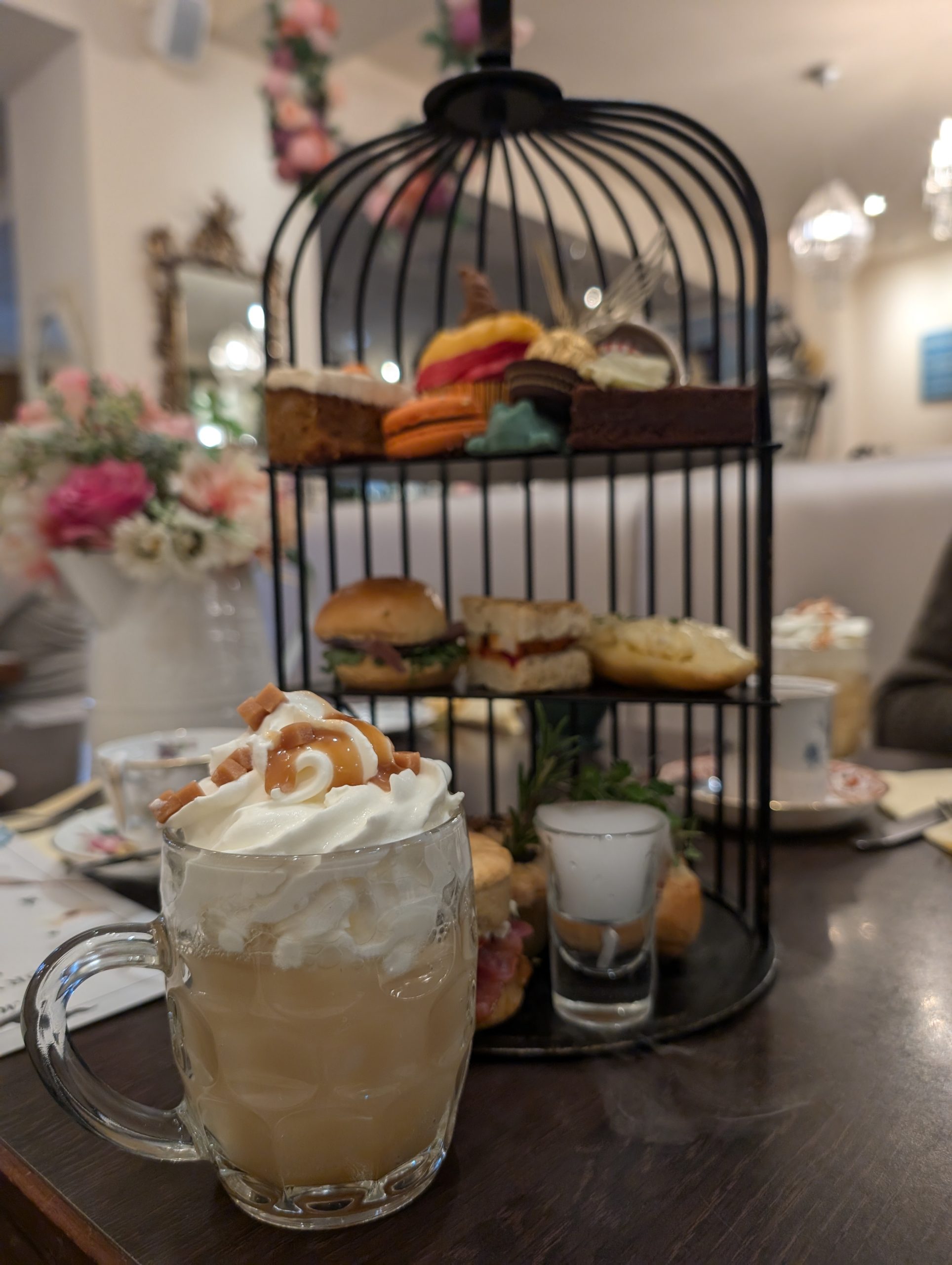 Dessert stand decorated with flowers at Mama Doreen’s in Harrogate