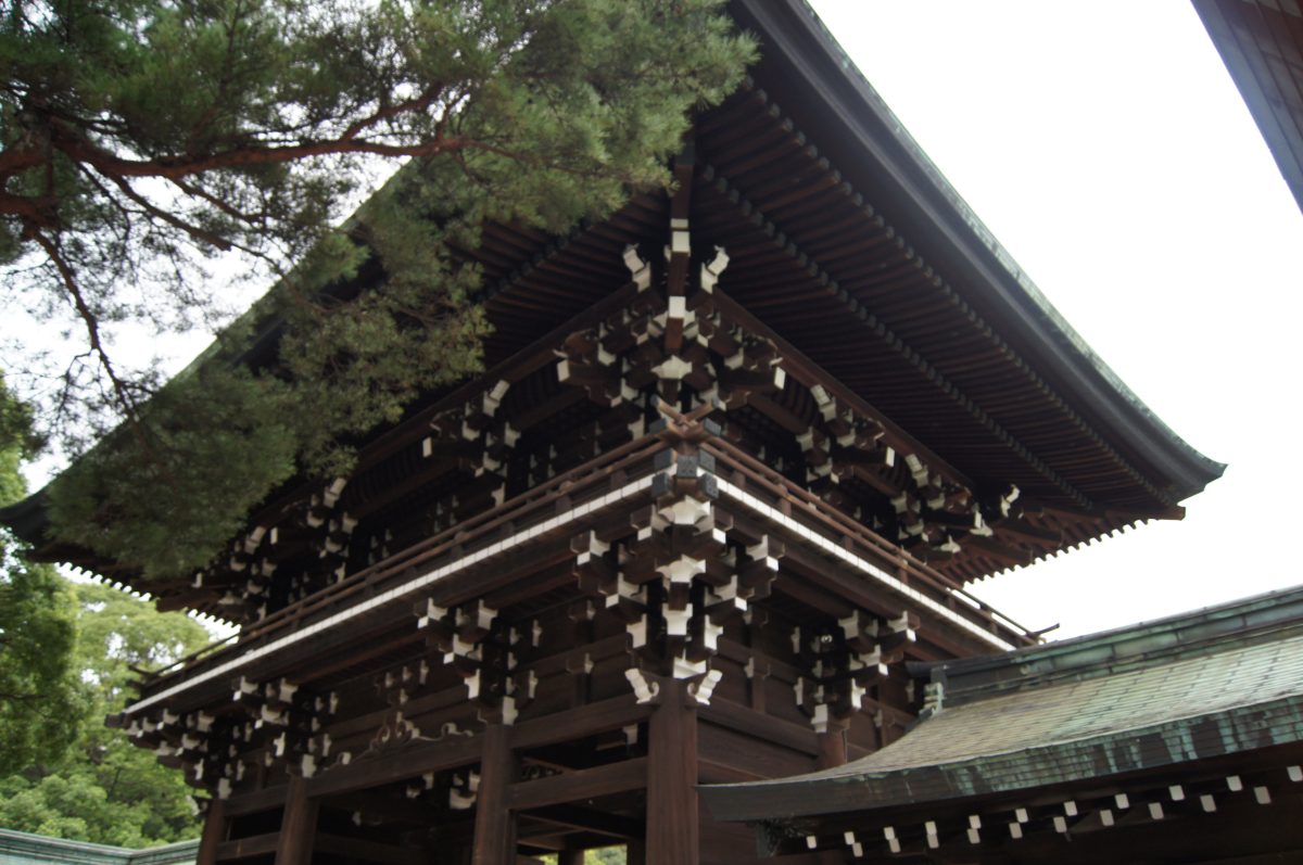 Detail of the carved eaves of a wooden shrine gate at Meiji Jingu.