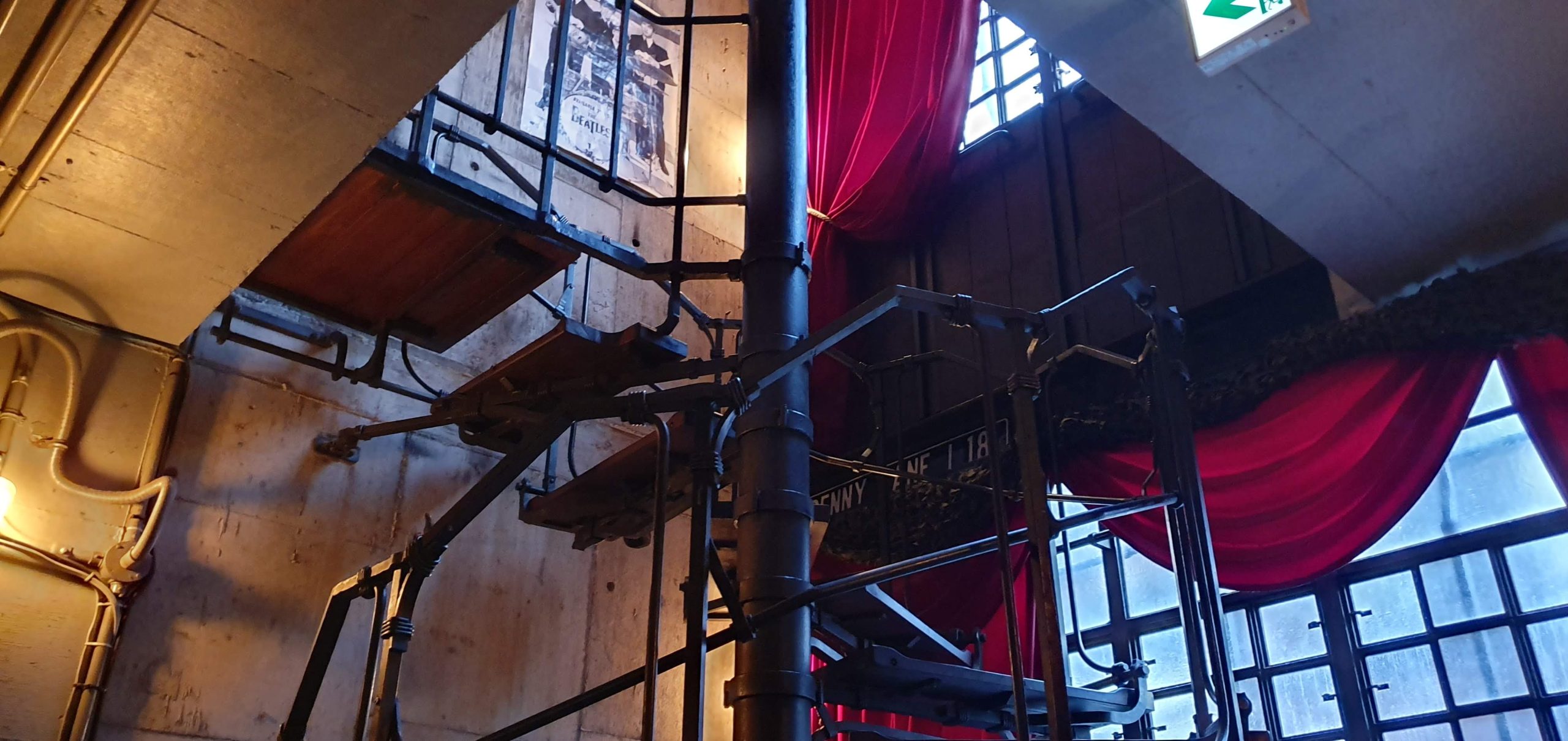 Nakameguro 36 scaled Metal stairs and red curtains inside Seirinkan in 2019