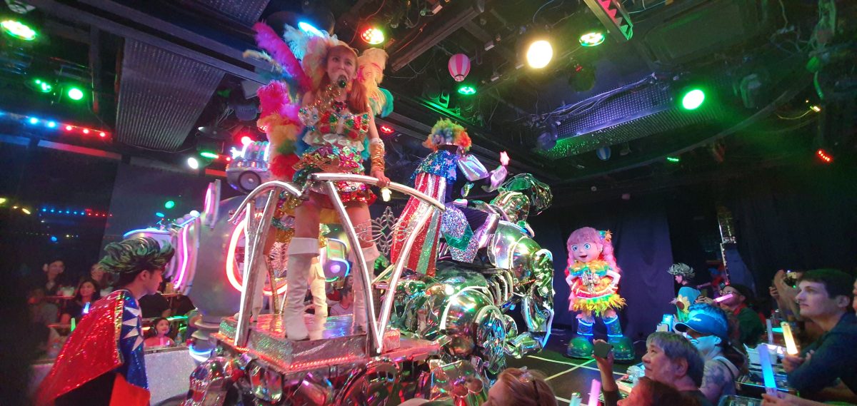 Robot Restaurant 311 A dancer riding a colourful motorcycle-style float during the Robot Restaurant show