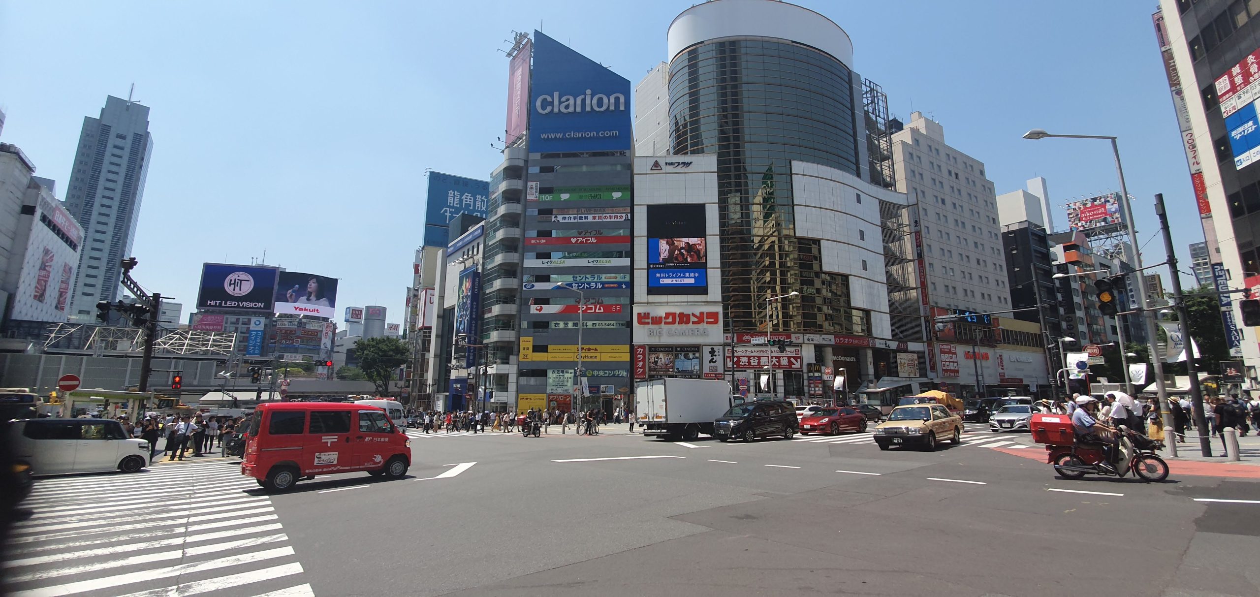 Shinjuku Station 15 scaled Shibuya Scramble Crossing with the Shibuya 109 building beyond.