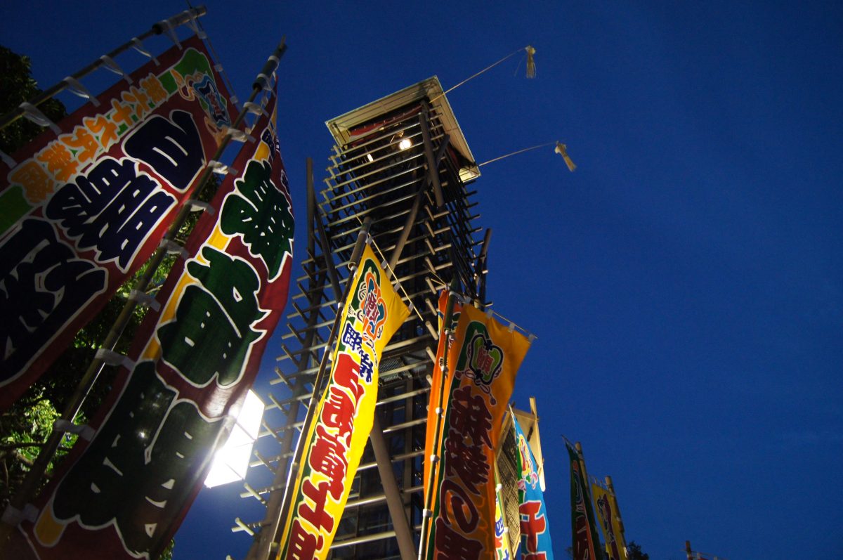 Sumo Tournament 29 Colourful sumo banners and the drum tower outside Ryogoku Kokugikan at dusk