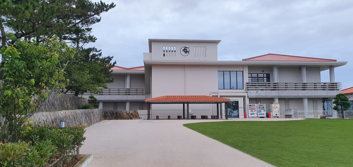 The white Yuntanza Museum building stands beside lawns near Zakimi Castle in Yomitan, Okinawa.
