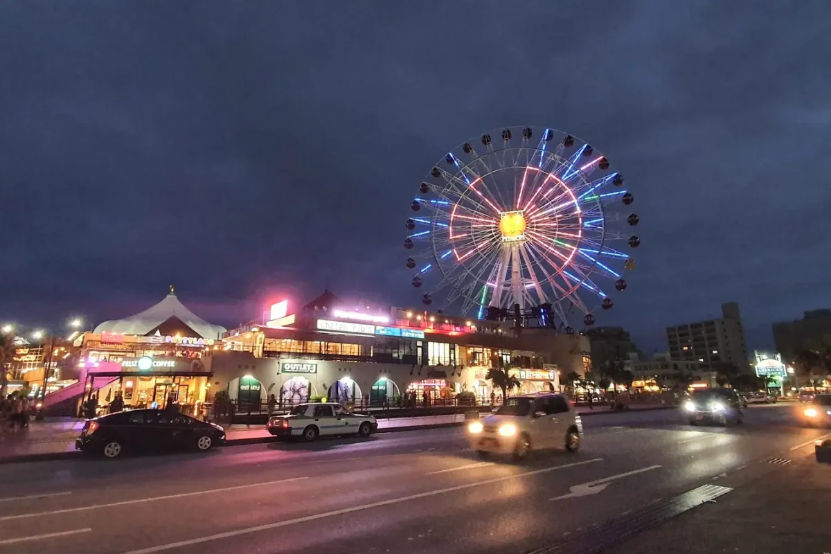 okinawa american village street view 2019 11452 Street view towards illuminated buildings and the Ferris wheel at American Village in May 2019