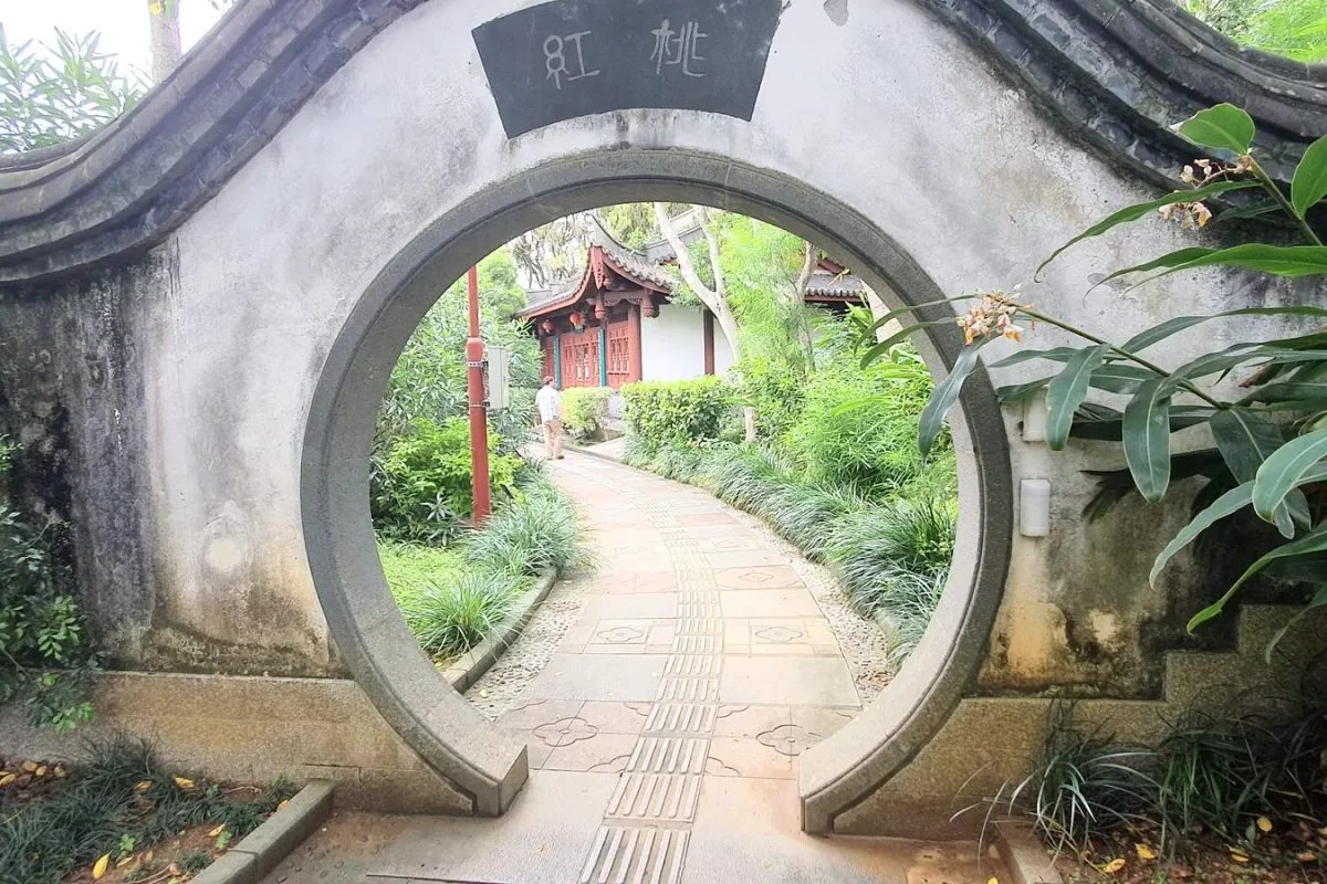 okinawa circular gateway at fukushu en garden 11459 Round stone gateway framing a garden path at Fukushu-en Garden in Naha