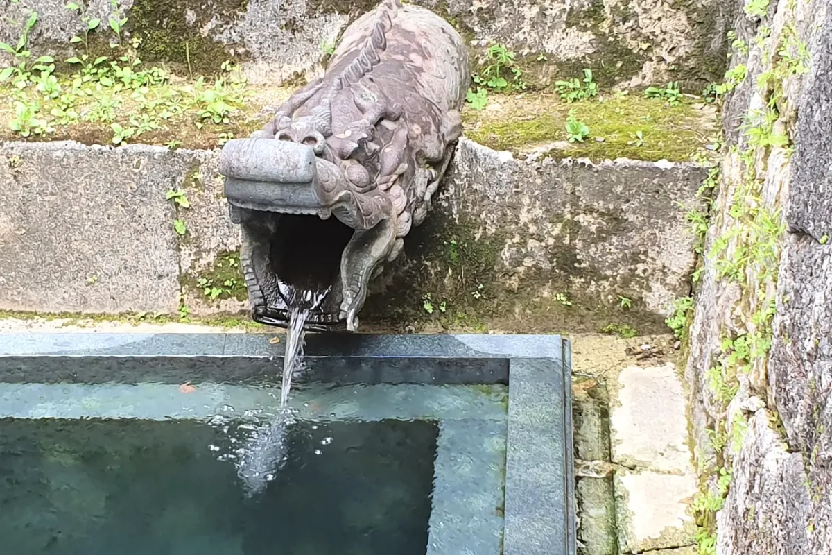 Stone dragon water spout at Shuri Castle