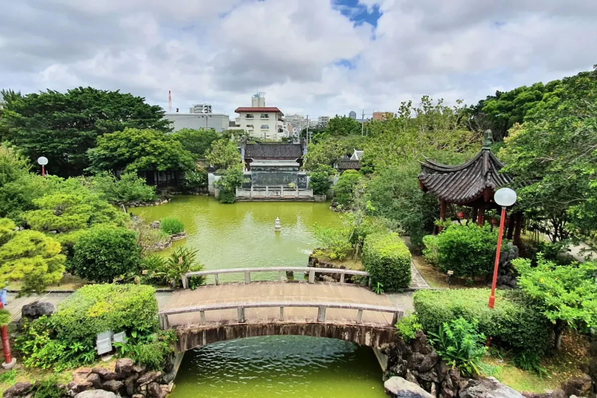 okinawa fukushu en garden bridge and pond in naha 11456 Wide view over the pond, stone bridge and pavilions at Fukushu-en Garden in Naha