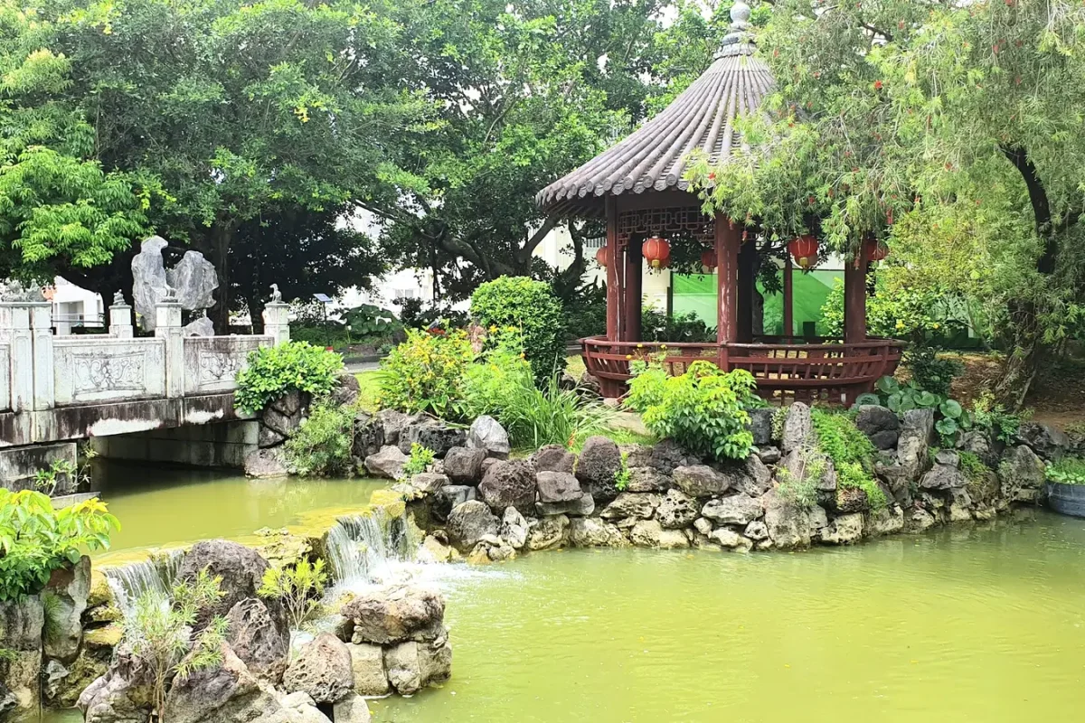 okinawa fukushu en garden pavilion and pond 11457 Chinese-style pavilion beside a stone bridge and pond at Fukushu-en Garden