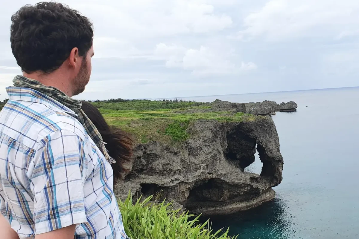 Gary looking towards the rock arch at Cape Manzamo