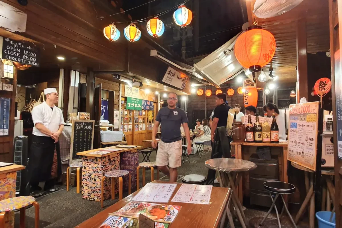 okinawa naha food village evening 11344 Lanterns above restaurant tables at Naha food village