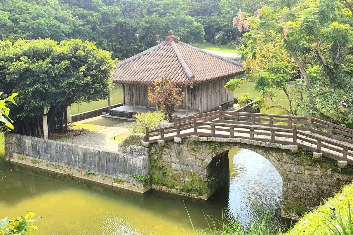 Pavilion and stone bridge over a pond in the grounds of Shuri Castle