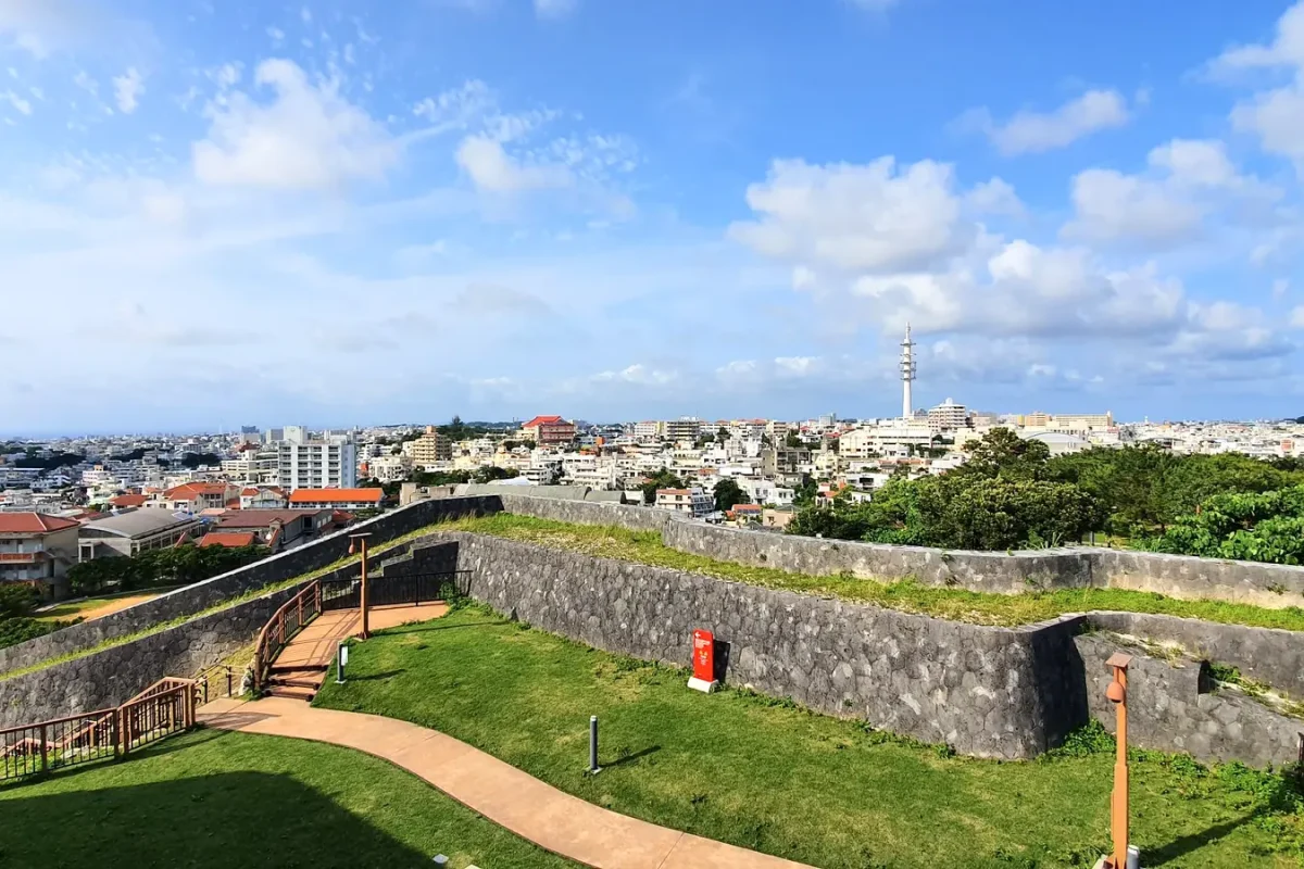 Stone walls of Shuri Castle overlooking Naha in May 2019