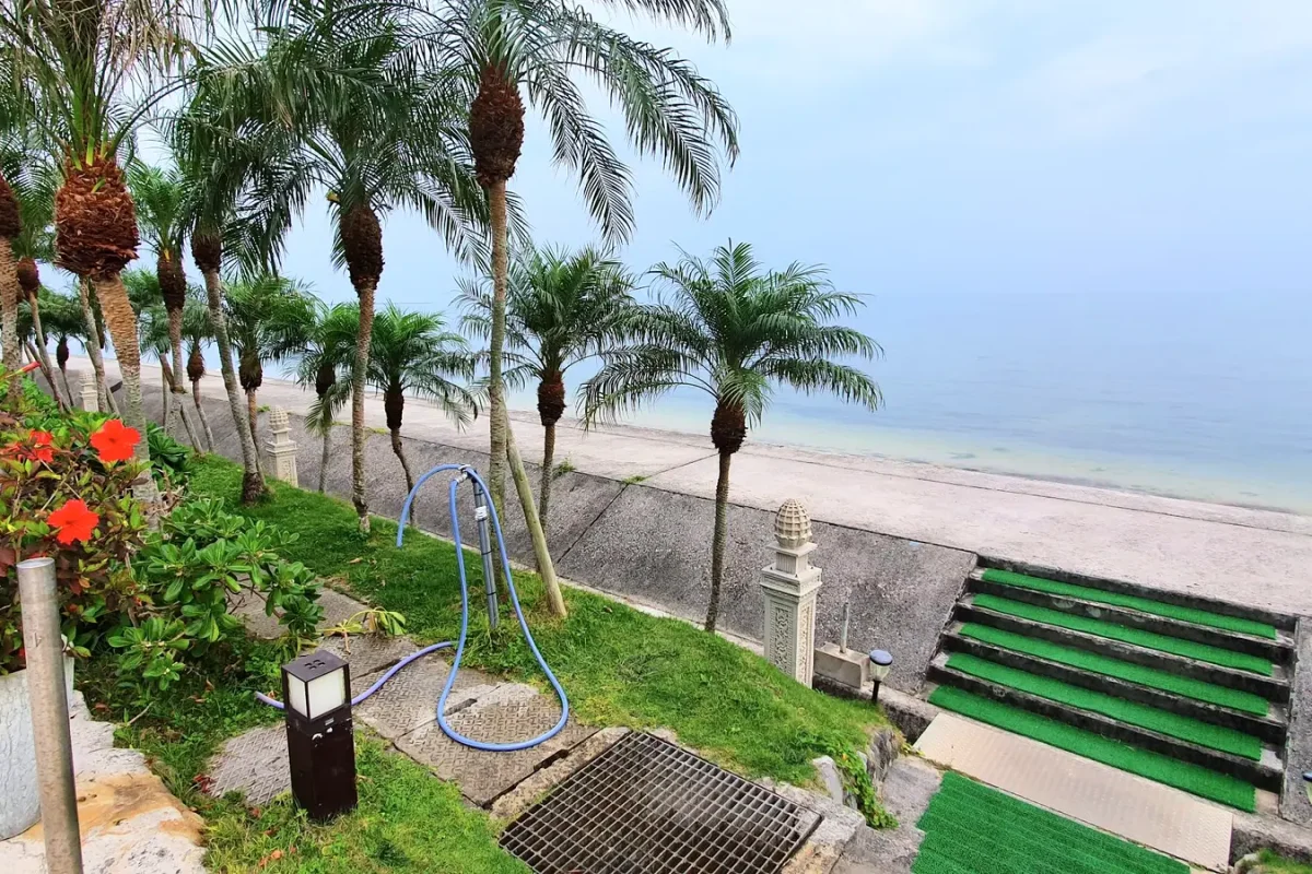 Palms, flowers and steps beside the waterfront at Grandvrio Resort Ishigakijima