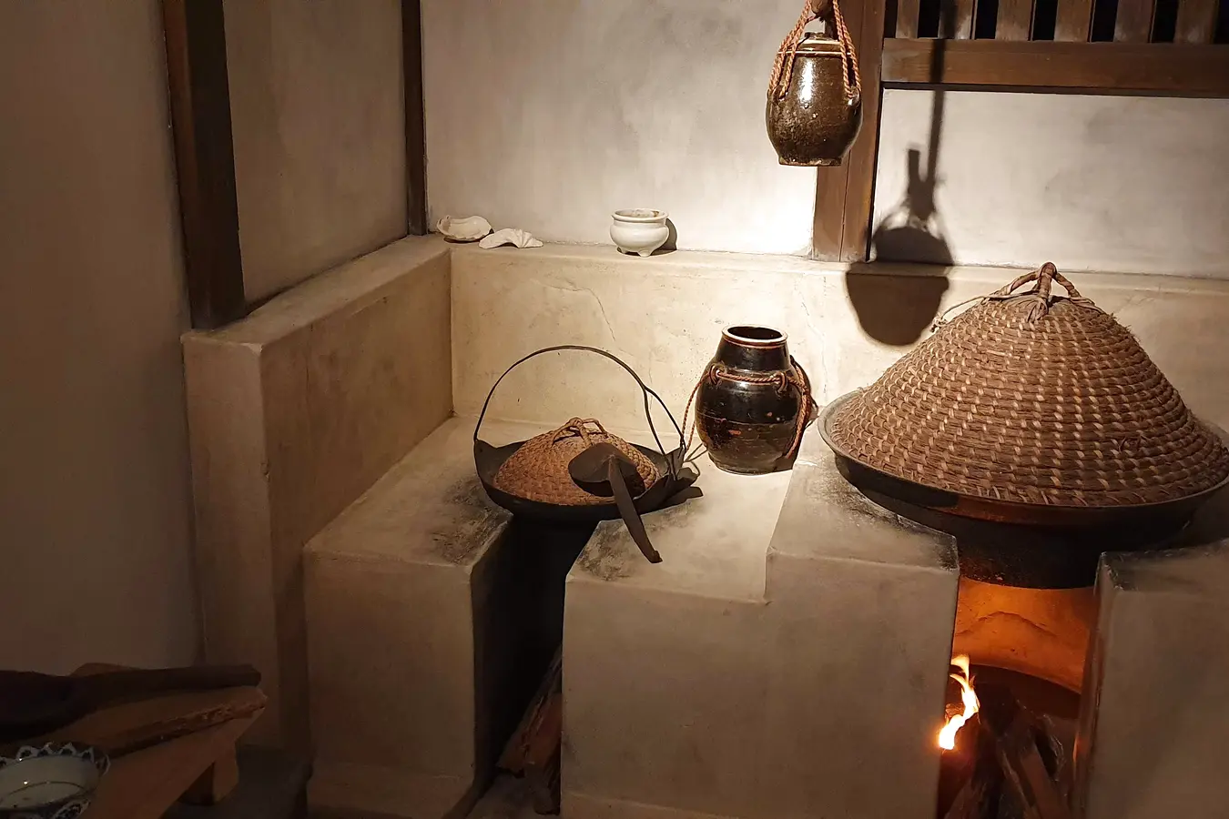 uf 0e97d719c0484983 Hearth and cooking equipment in a reconstructed traditional kitchen at Okinawa Prefectural Museum