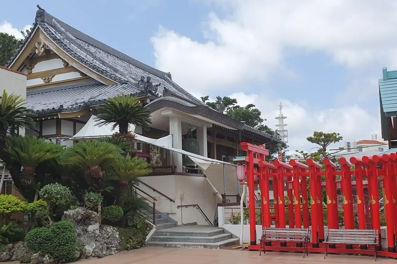 Temple courtyard and red gates at Sairaiin in Shuri