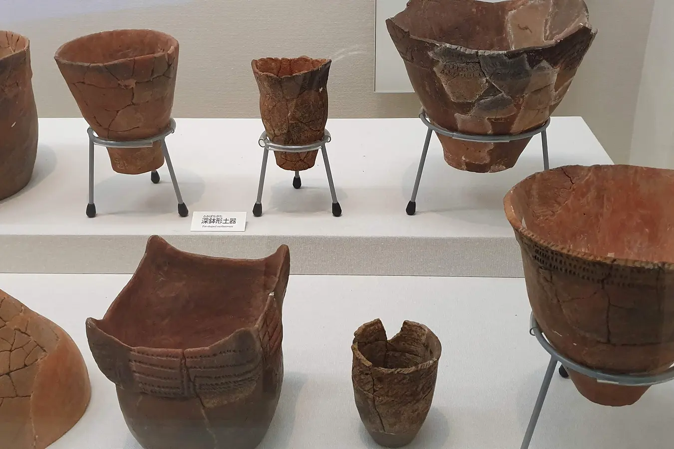 uf 2e9118570cc34ac3 Earthenware vessels in a display case at Okinawa Prefectural Museum