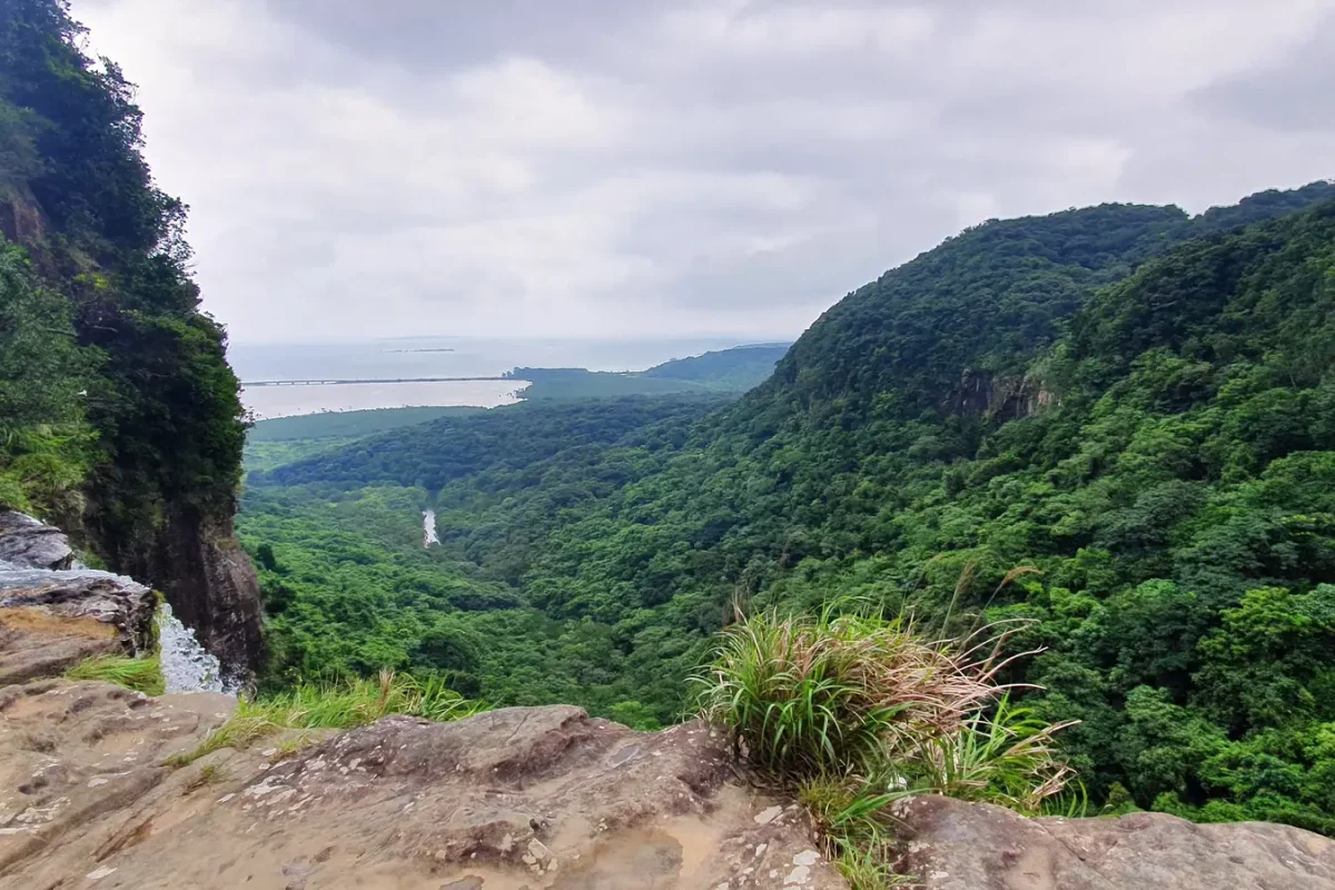 uf bc54c11d6be540c9 Forested valley, river and coastline seen from the top of Pinaisara Falls